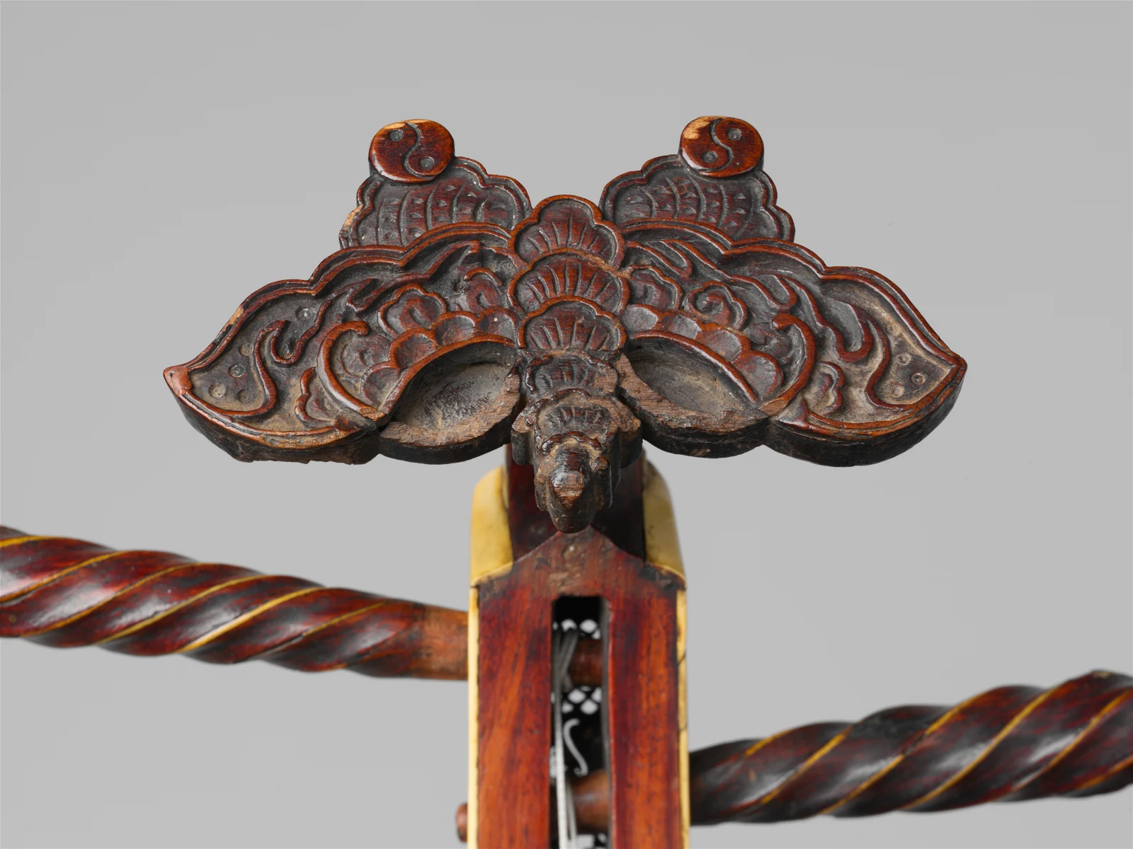 Carved headstock detail of a historic Chinese pipa in the Metropolitan Museum of Art